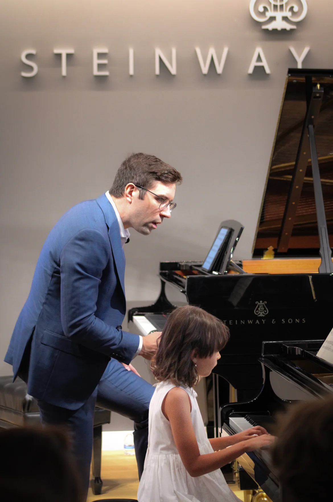 Dr. Guida teaching beside Amelia at the piano