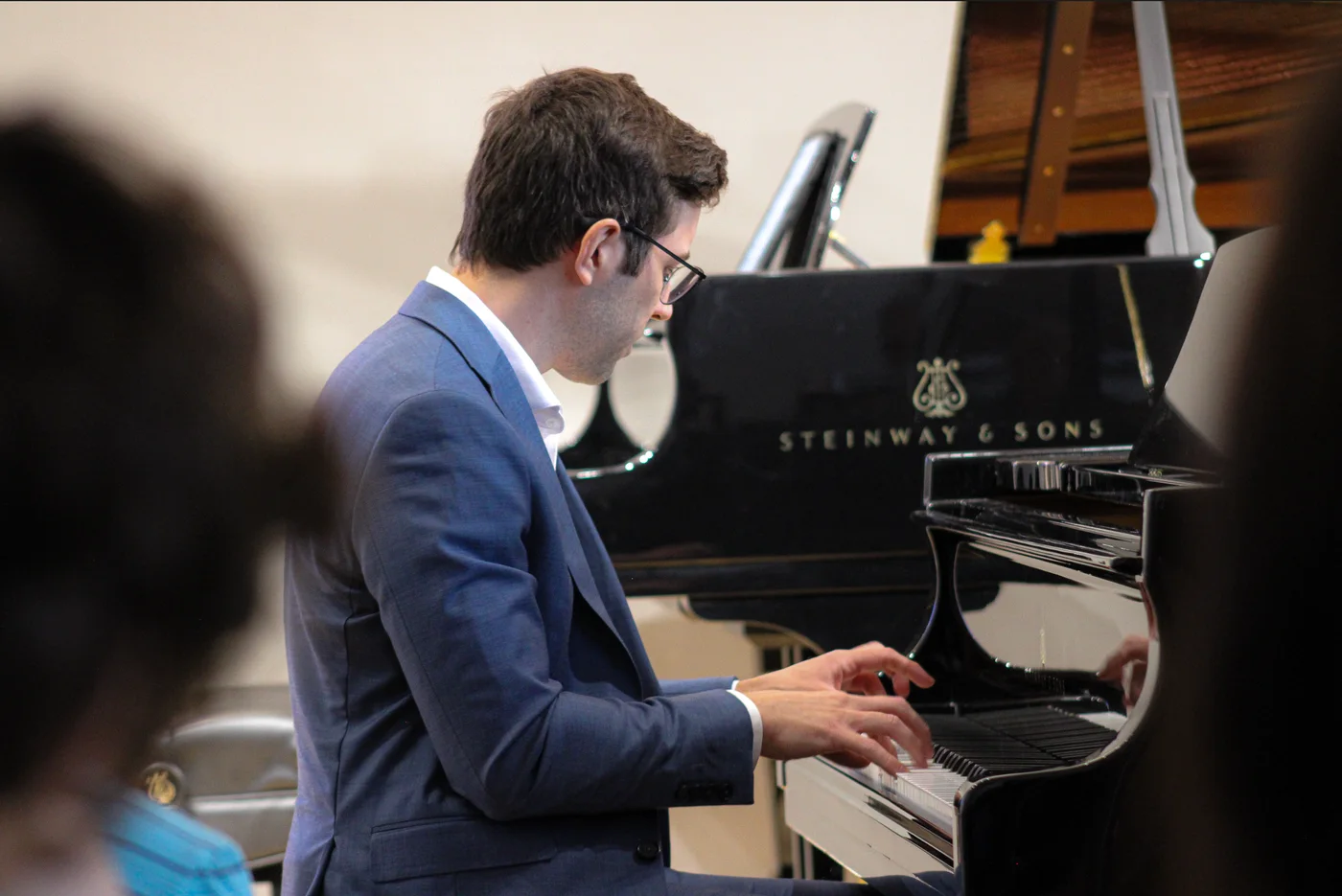 Dr. Michael Guida performing at the Steinway grand piano
