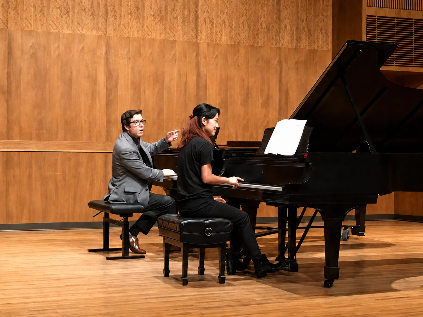 Dr. Michael Guida coaching a student during a piano masterclass