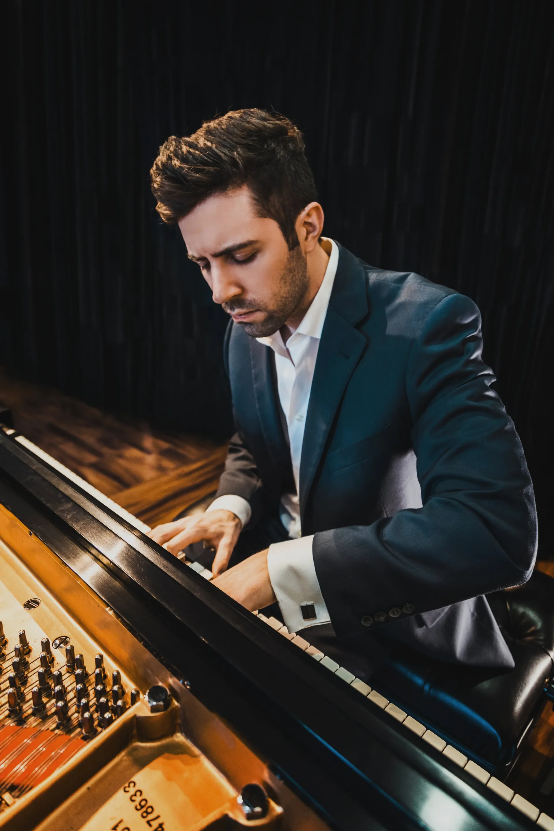 Dr. Michael Guida performing at the piano