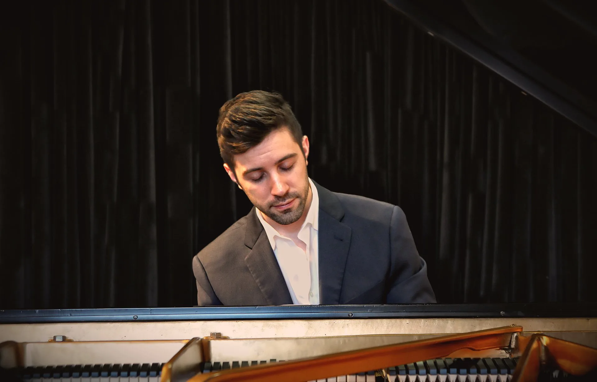 Dr. Michael Guida performing at the piano